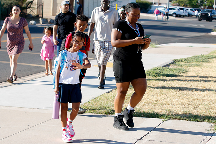 Students walk to school on the first day
